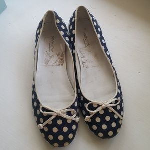 Worn poka dot flats
